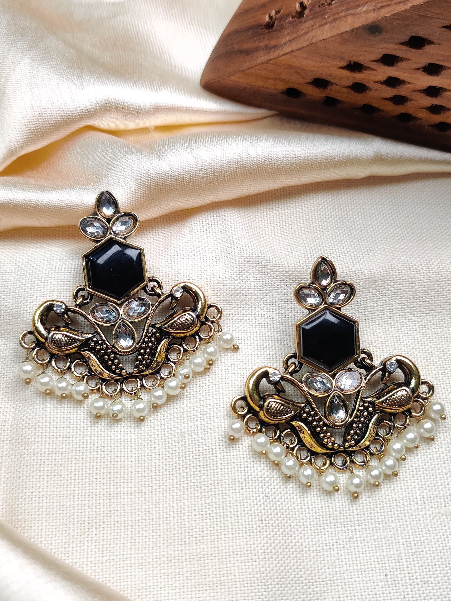 Golden peacock earrings with black stone & pearl drops
