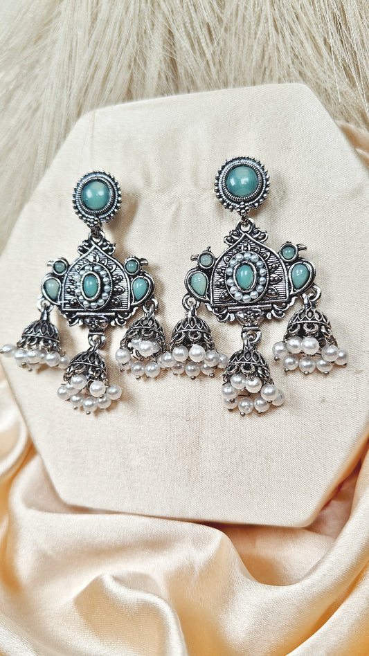 Mint green stone oxidised silver long jhumka earrings