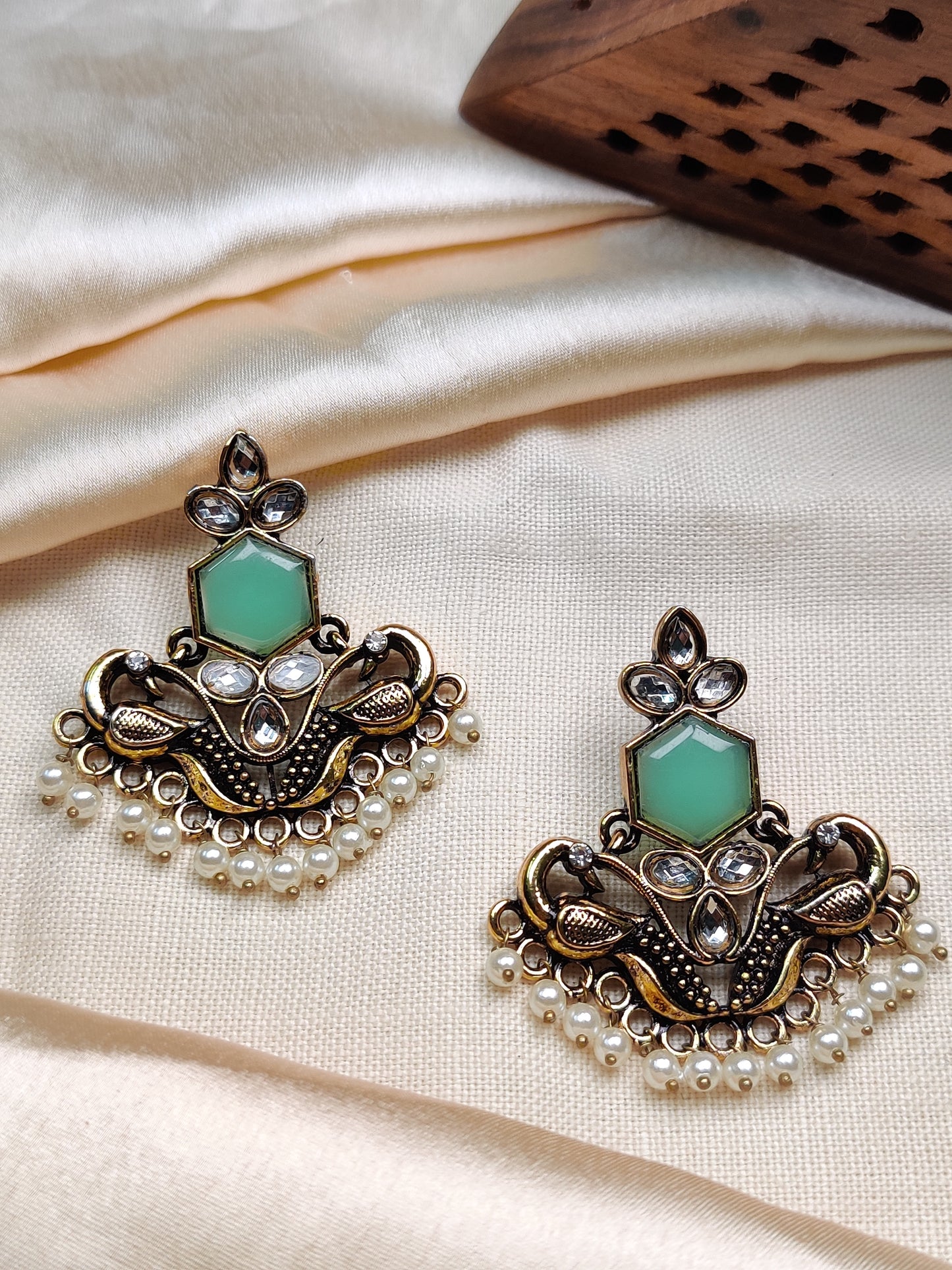 Golden peacock earrings with green stone & pearl drops