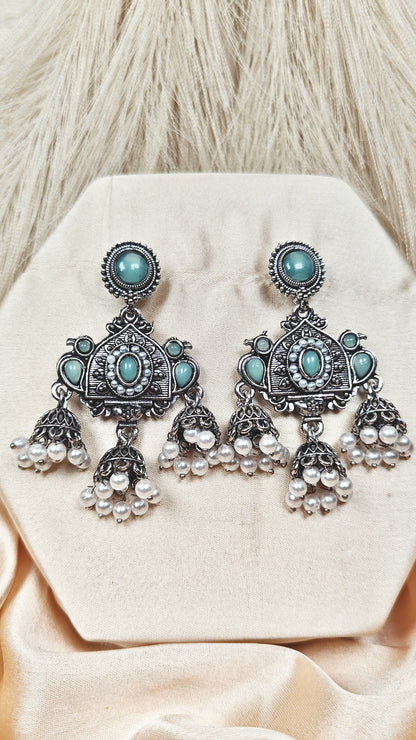 Mint green stone oxidised silver long jhumka earrings
