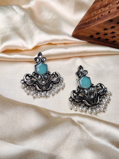 Silver peacock earrings with blue stone & pearl beads