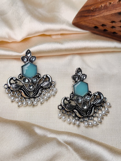 Silver peacock earrings with blue stone & pearl beads
