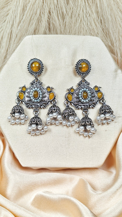 Yellow stone oxidised silver long jhumka earrings