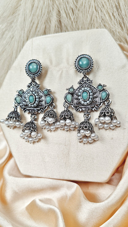 Mint green stone oxidised silver long jhumka earrings